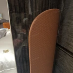 Curved-Top Leather Bed with Channel Tufting and High-Gloss Wooden Side Panels